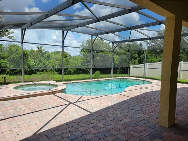a bathroom with a granite countertop toilet sink and mirror