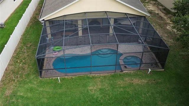 a bedroom with two beds and painting on the wall