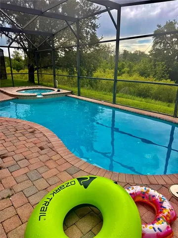 a white bath tub sitting next to a white toilet