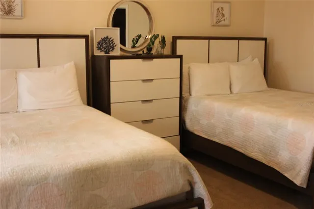 a kitchen with stainless steel appliances kitchen island granite countertop a sink a stove counter space and cabinets