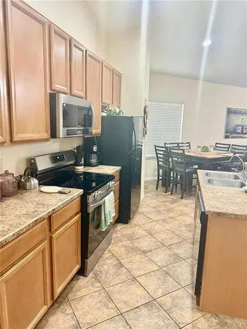 a bedroom with a bed and a night stand