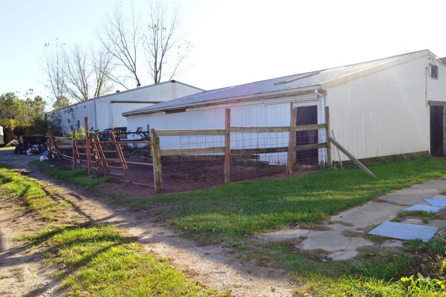 2 large barns. Front barn with horse stalls. Rear barn open arena.