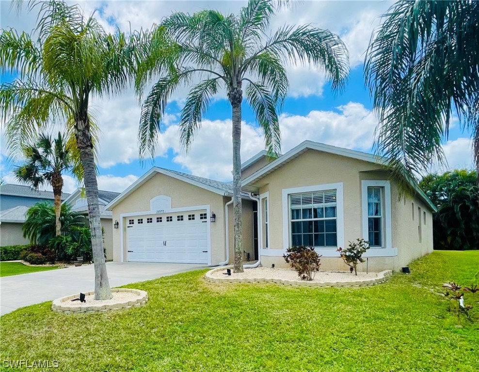 a view of house with backyard and swimming pool
