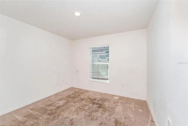 a view of a room with a hallway