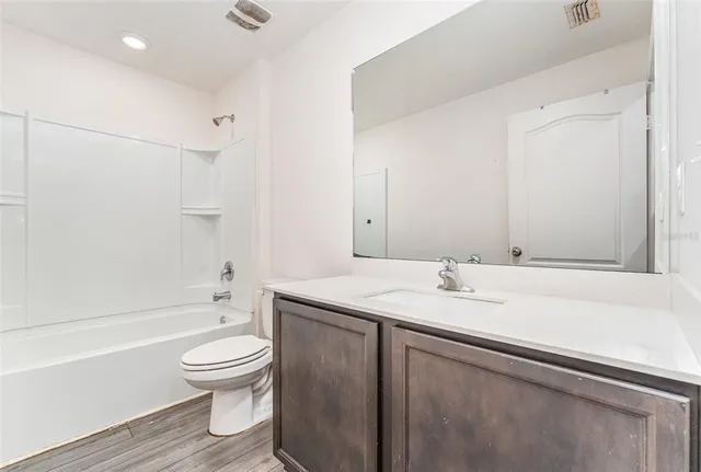 a bathroom with a double vanity sink and mirror