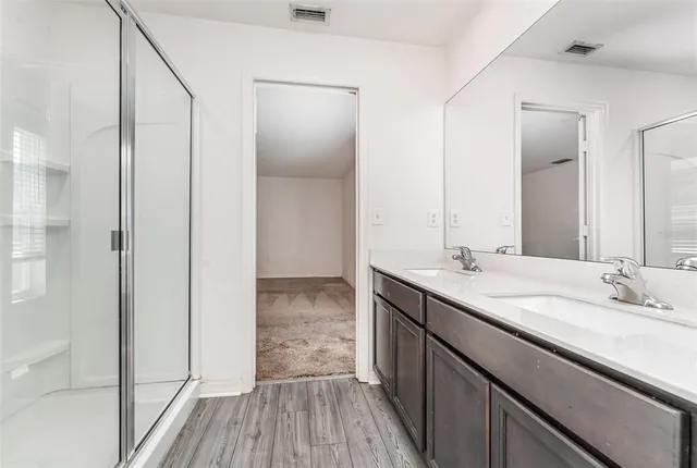 a backyard of a house with lots of green space and garden