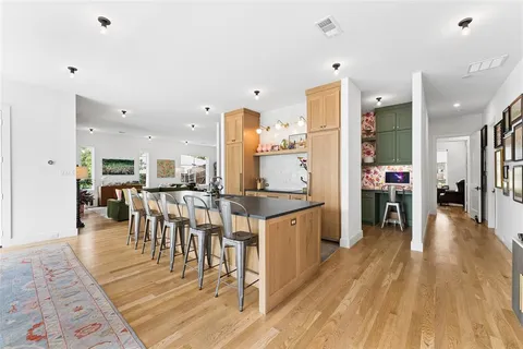 a kitchen with lots of counter top space and furniture