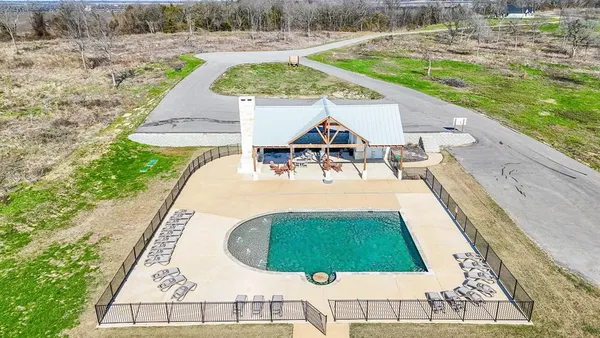 an aerial view of a house with outdoor space patio and ocean view