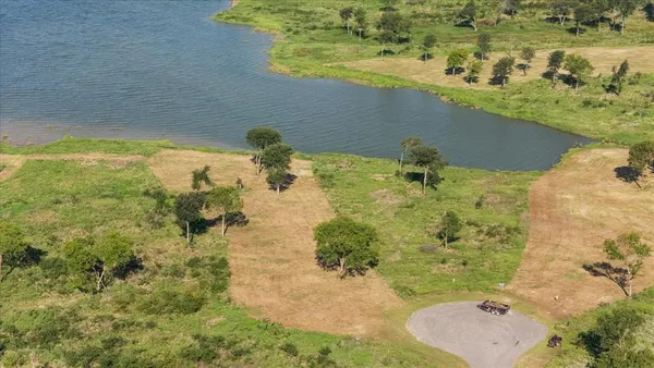 an aerial view of a residential houses with outdoor space