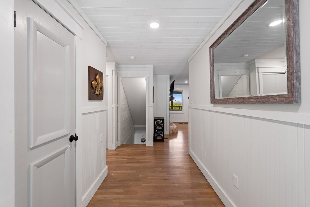 760 River Bend Lane Blue Ridge, GA 30513 - Photo 14 of 101 a view of a hallway with wooden floor and staircase