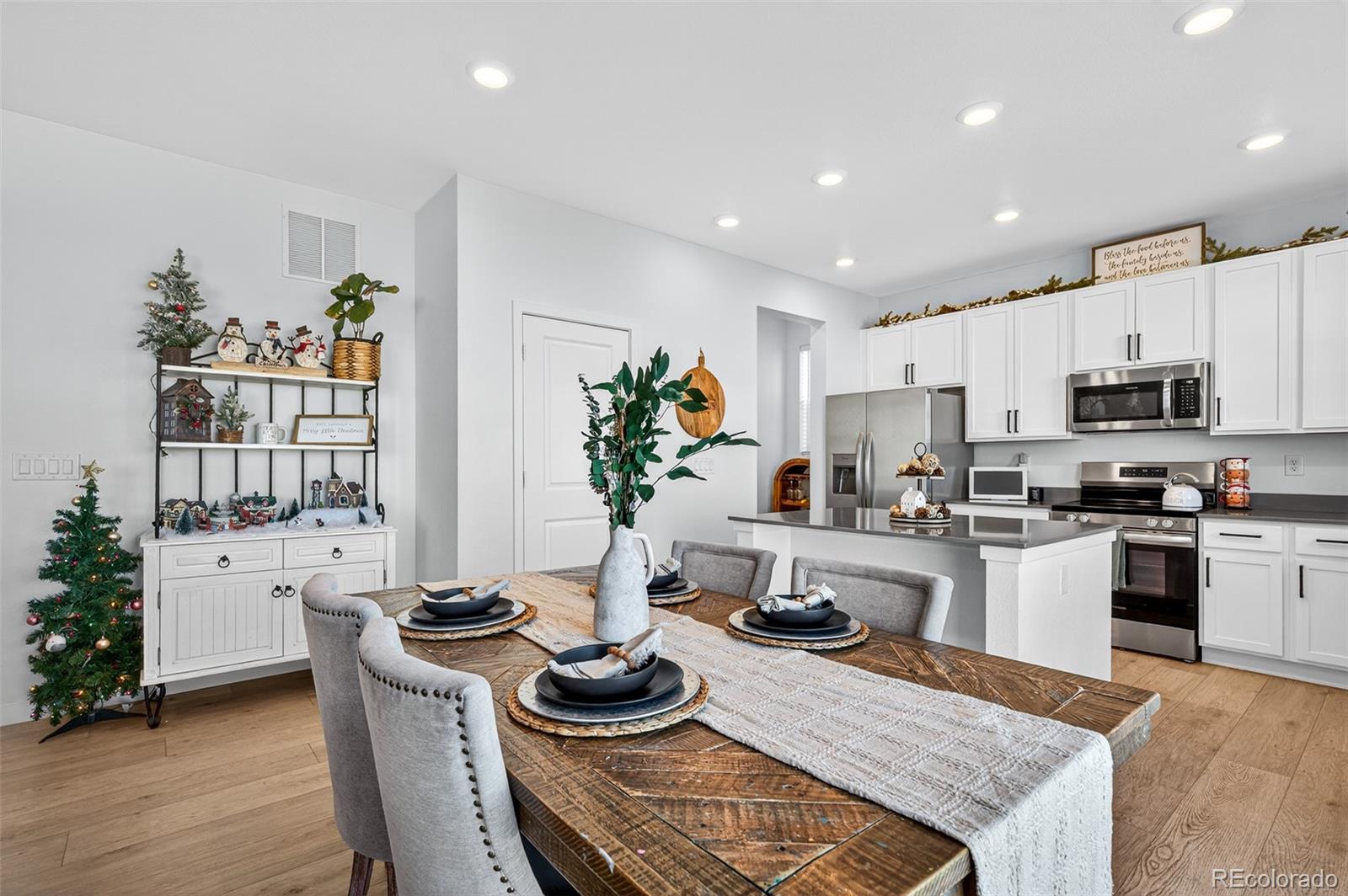 233 Corkscrew Street Elizabeth, CO 80107 - Photo 13 of 33 a kitchen with a table and chairs in it
