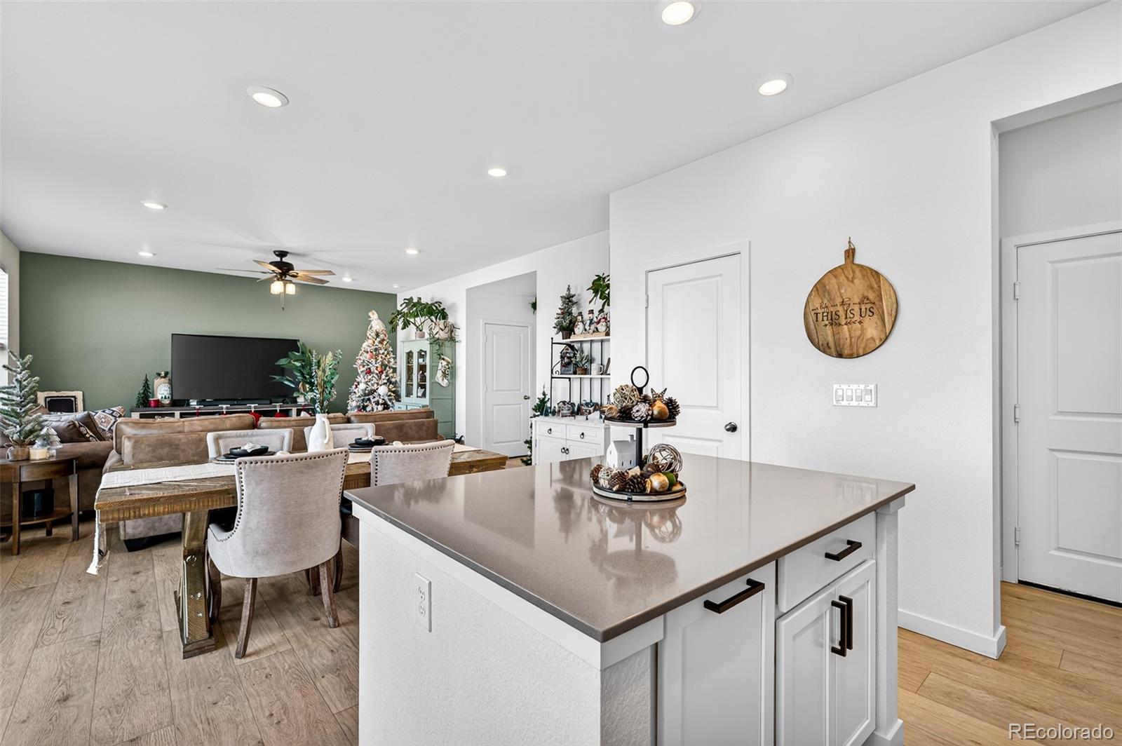 233 Corkscrew Street Elizabeth, CO 80107 - Photo 16 of 33 a view of a dining room with furniture and wooden floor