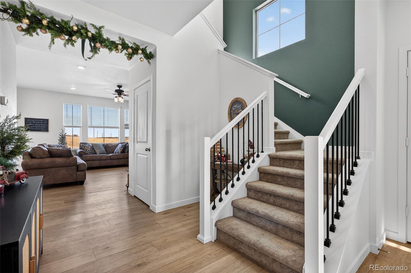 233 Corkscrew Street Elizabeth, CO 80107 - Photo 2 of 33 a view of entryway and hall with wooden floor
