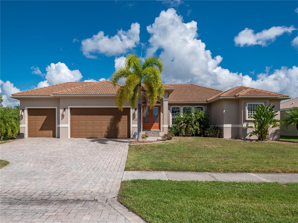 1636 Suzi Street Punta Gorda, FL 33950 - Photo 1 of 1 a front view of a house with a garden and plants