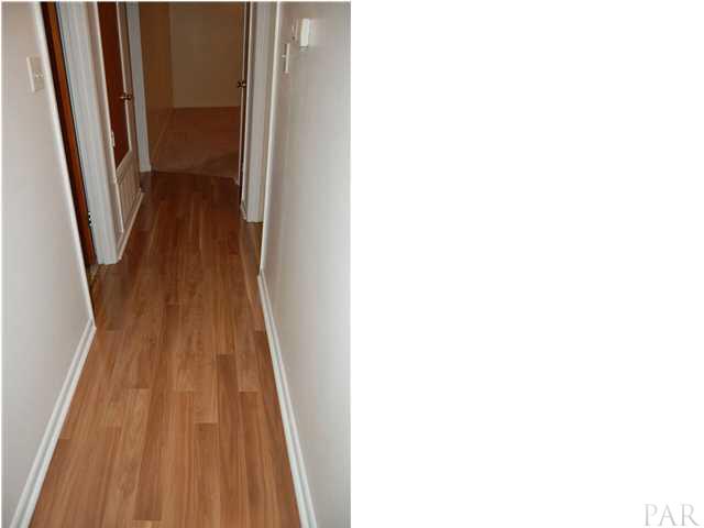 6304 Keating Road Pensacola, FL 32504 - Photo 15 of 23 hallway with new laminate flooring