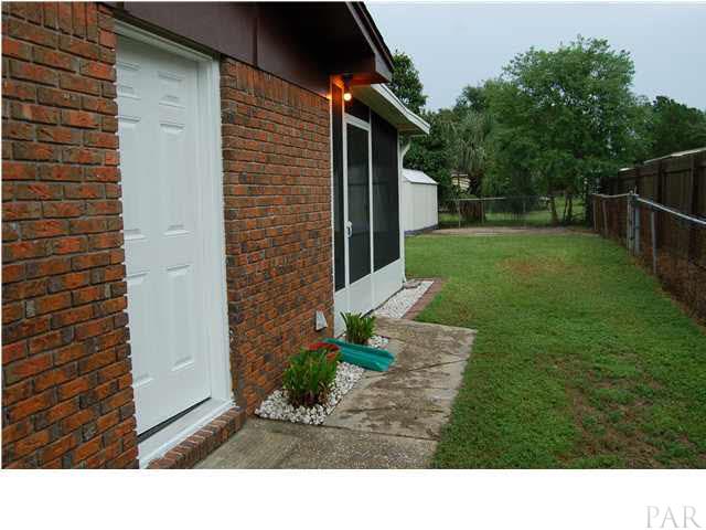 6304 Keating Road Pensacola, FL 32504 - Photo 20 of 23 side yard with garage entrance