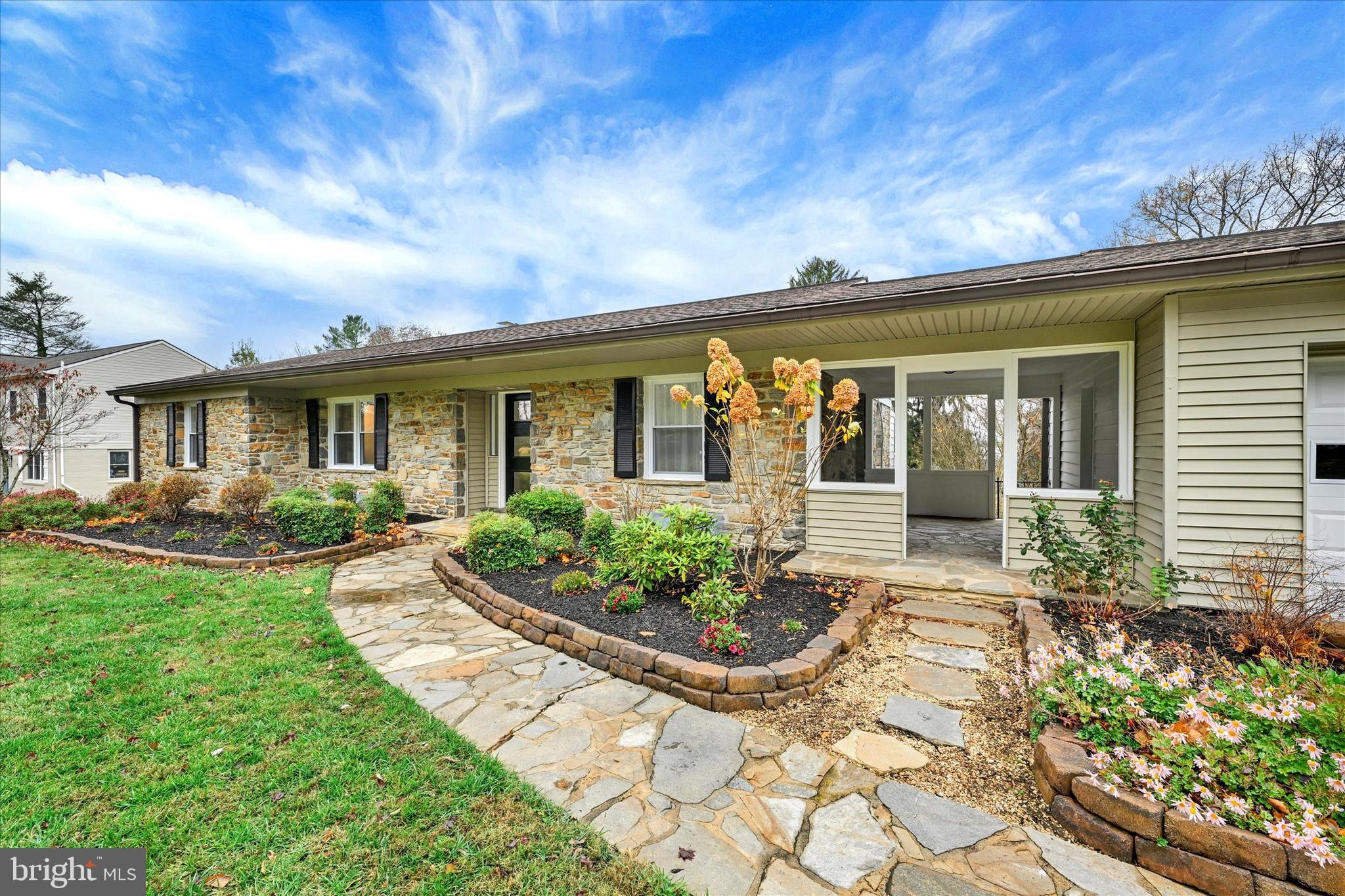 a front view of a house with garden
