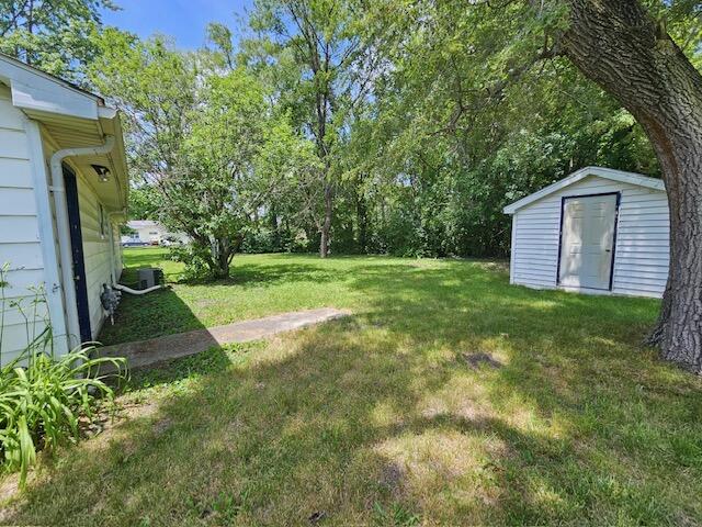 522 East Merritt Street Rensselaer, IN 47978 - Photo 15 of 15 a view of a backyard with large trees and plants