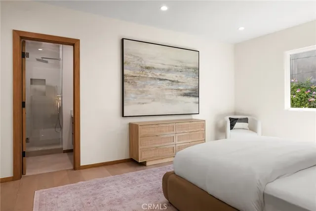 a bedroom with a bed and a dresser