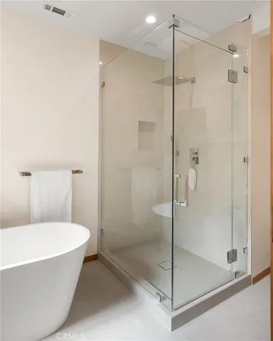 a bathroom with a bathtub and a shower