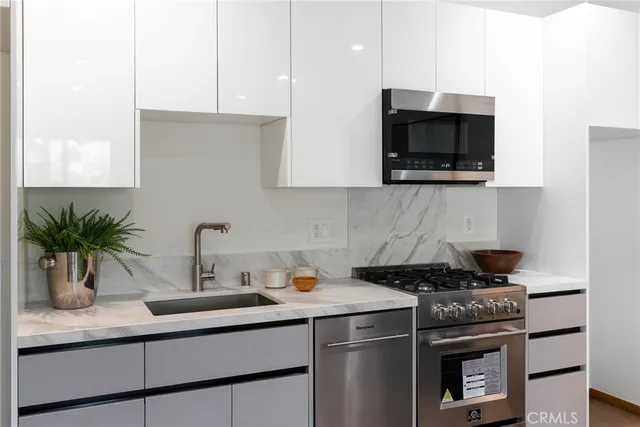 a kitchen with a stove and a microwave