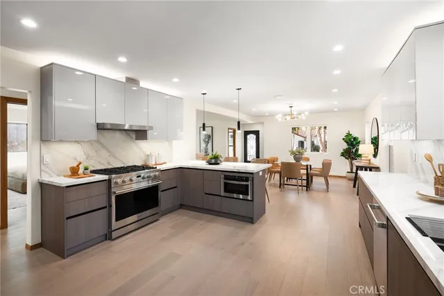 a view of kitchen with sink and stainless steel appliances