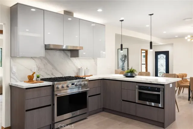 a kitchen with a stove sink and refrigerator