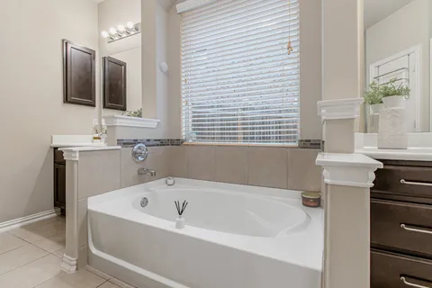 a bathroom with a bathtub and a sink