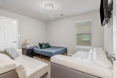 a living room with furniture and a window