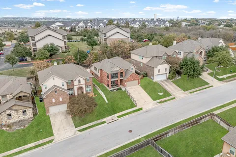 an aerial view of residential building and parking space