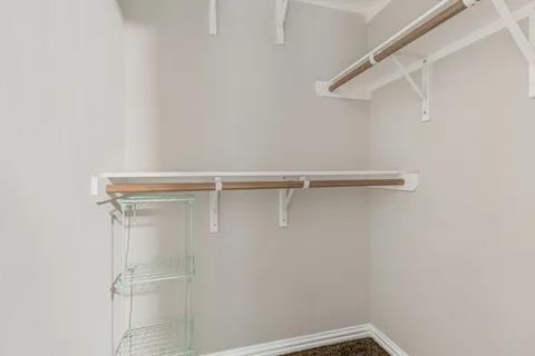 a view of an empty walk in closet