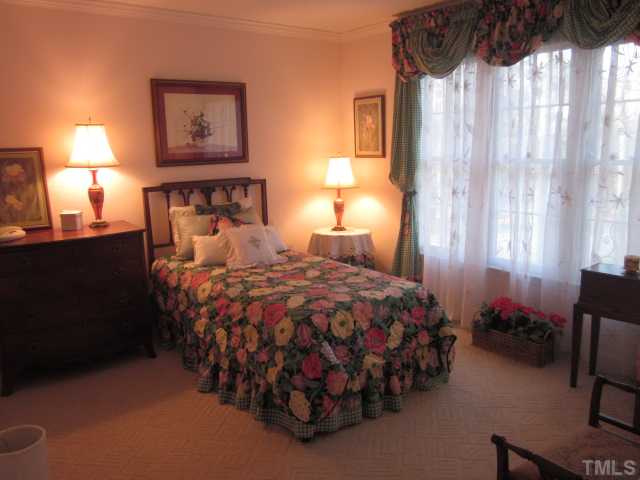 6708 Colony Court Raleigh, NC 27613 - Photo 22 of 25 Secondary bedroom features patterned berber carpet, crown molding, phone & cable jack! Room is good size!