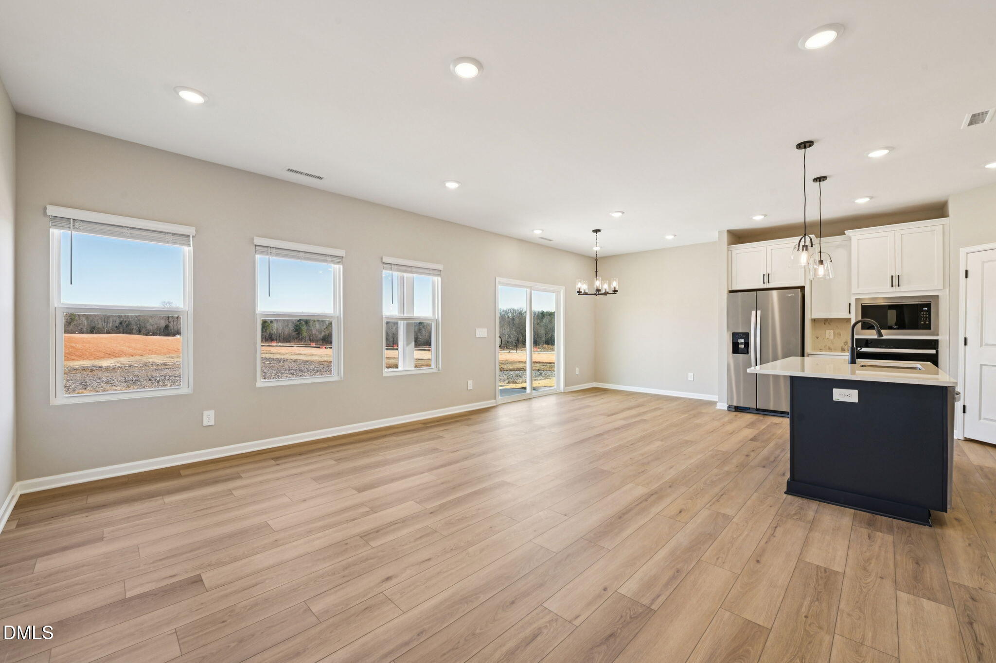 3516 Telluride Trail Raleigh, NC 27616 - Photo 13 of 47 a view of kitchen with stainless steel appliances kitchen island wooden floor and window