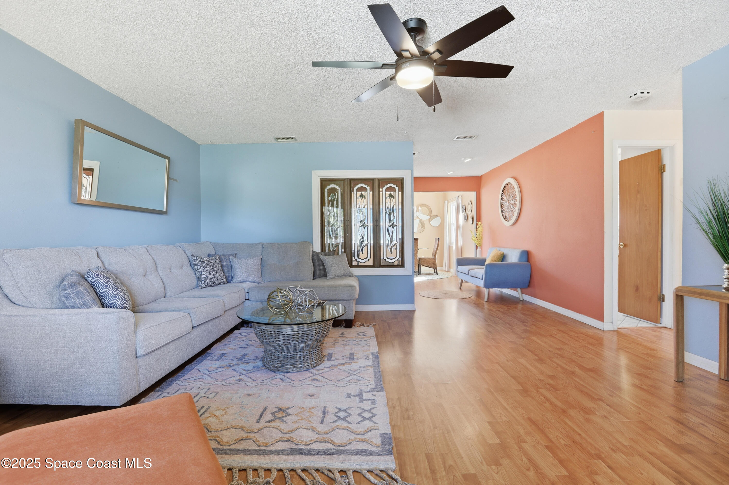 3929 Burkholm Road Mims, FL 32754 - Photo 7 of 51 a living room with furniture and a large window
