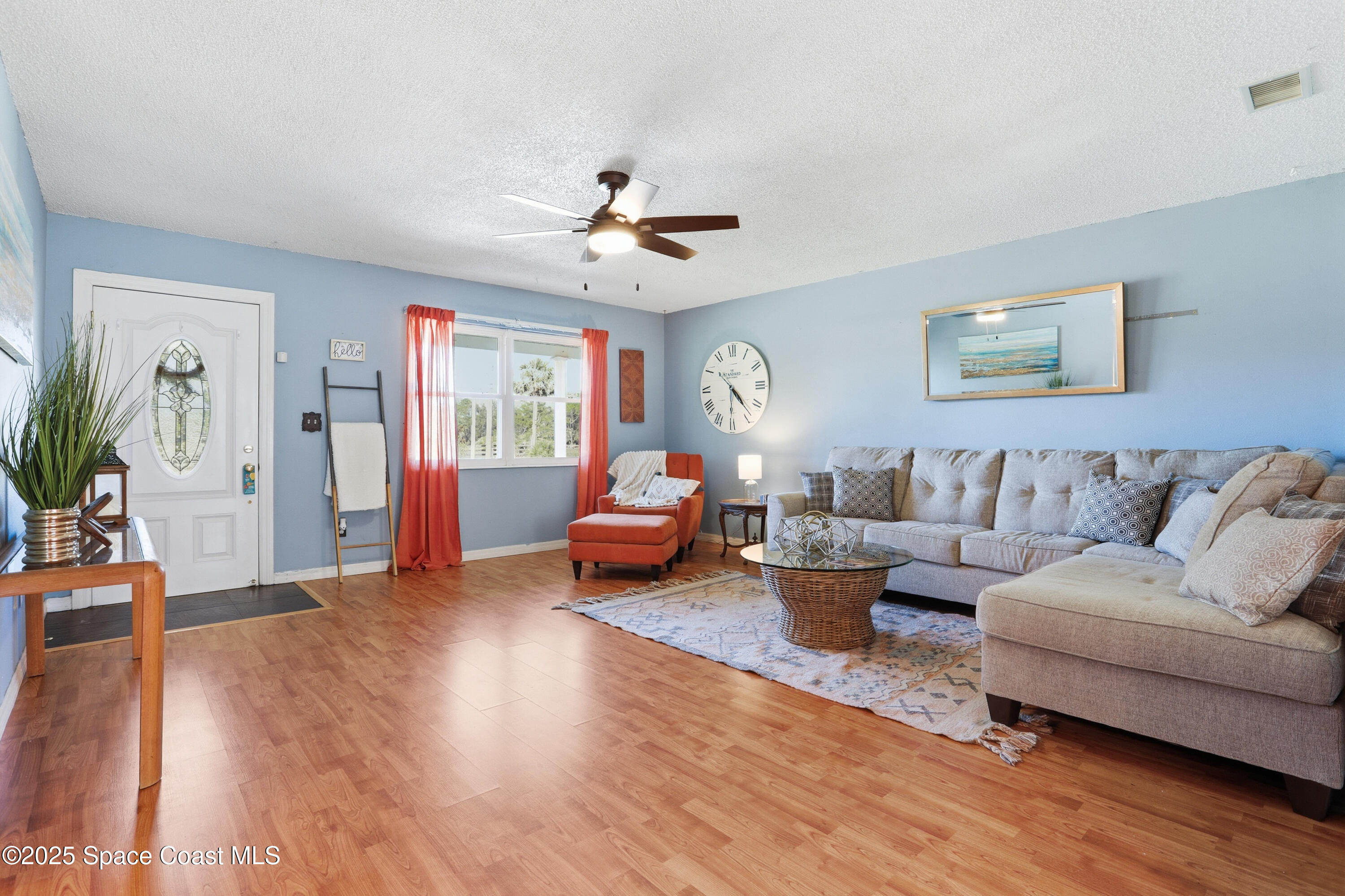 3929 Burkholm Road Mims, FL 32754 - Photo 9 of 51 a living room with furniture and wooden floor