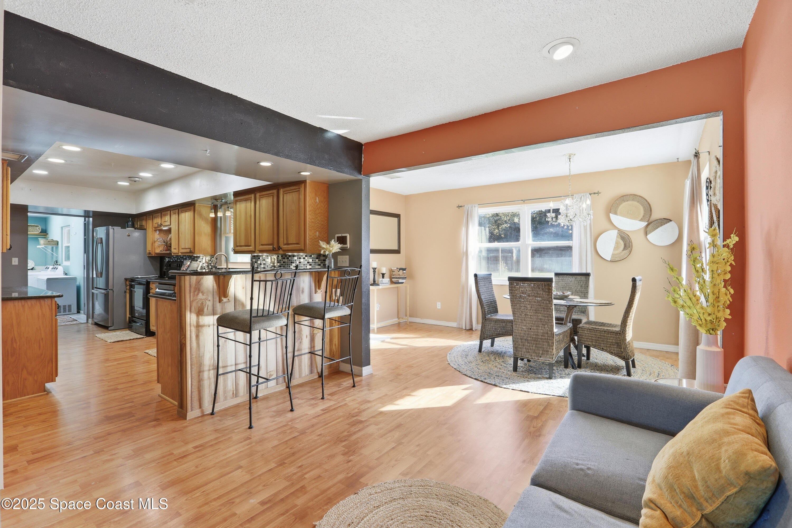 3929 Burkholm Road Mims, FL 32754 - Photo 10 of 51 a living room with furniture and a table