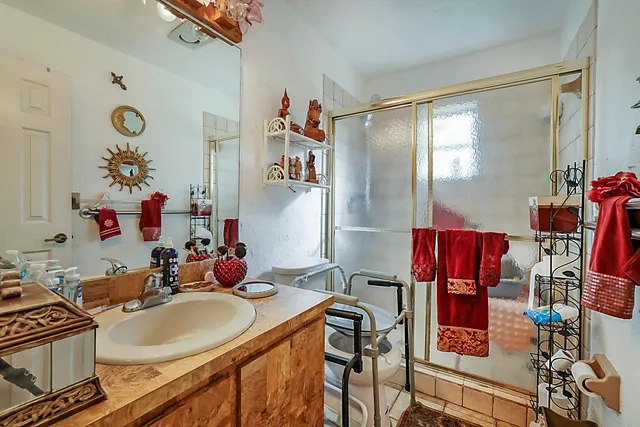 a bath room with a table chairs and a dining table