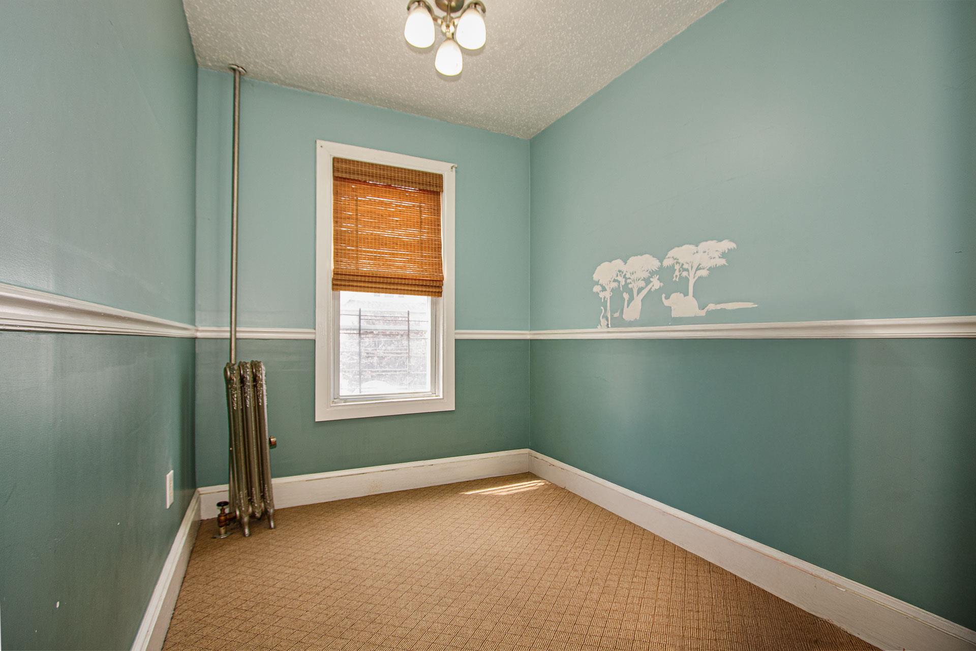 80-63 87th Road Queens, NY 11421 - Photo 11 of 24 a view of room with window and air conditioner