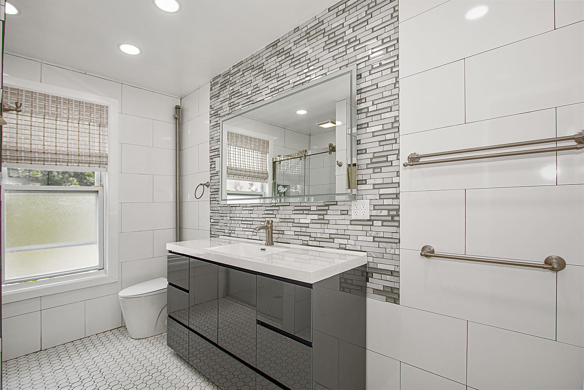 80-63 87th Road Queens, NY 11421 - Photo 12 of 24 a bathroom with a sink toilet and mirror