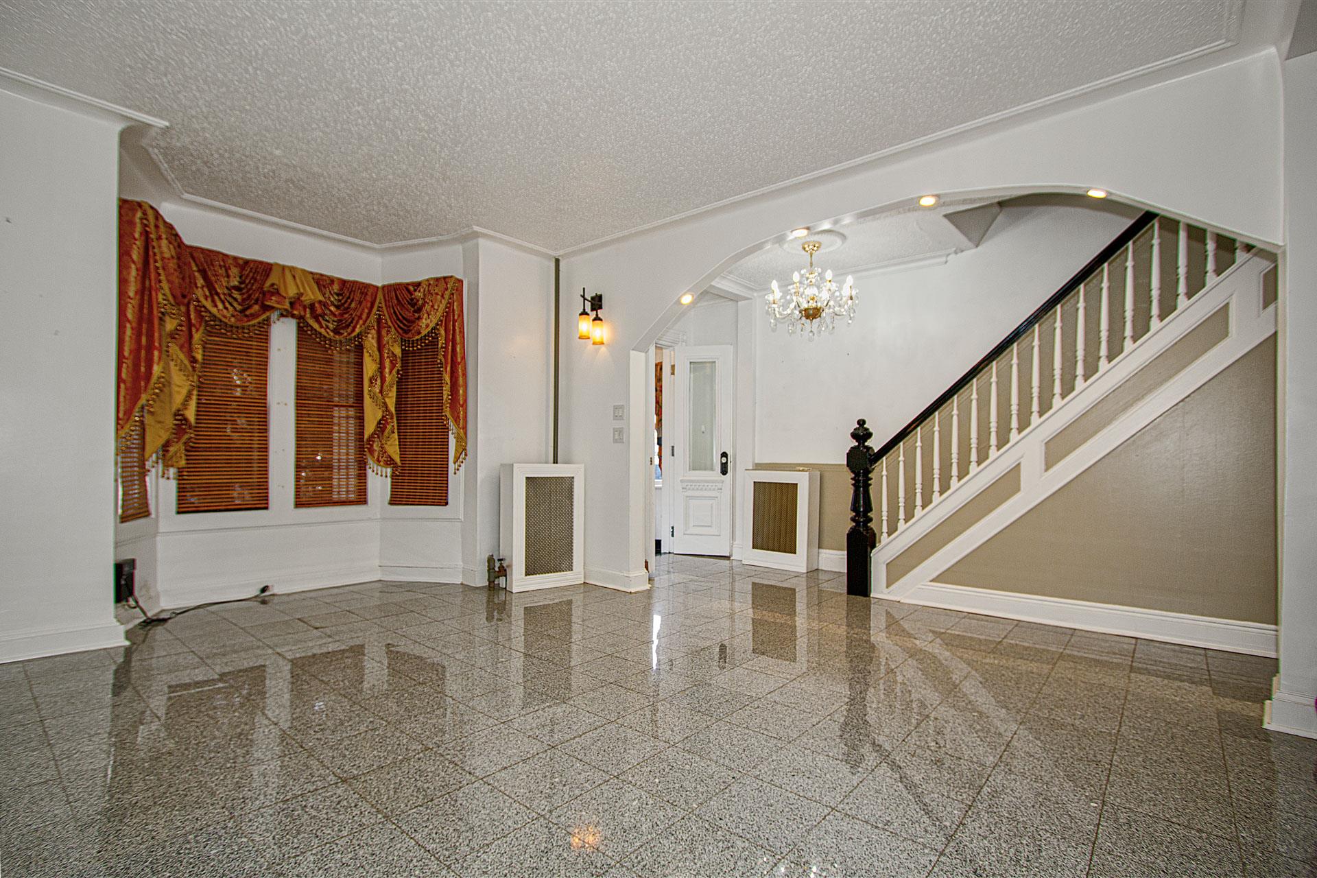 80-63 87th Road Queens, NY 11421 - Photo 4 of 24 a view of an entryway with staircase
