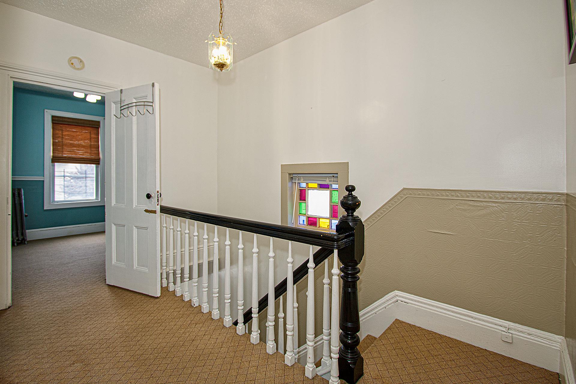 80-63 87th Road Queens, NY 11421 - Photo 7 of 24 a view of a hallway with windows