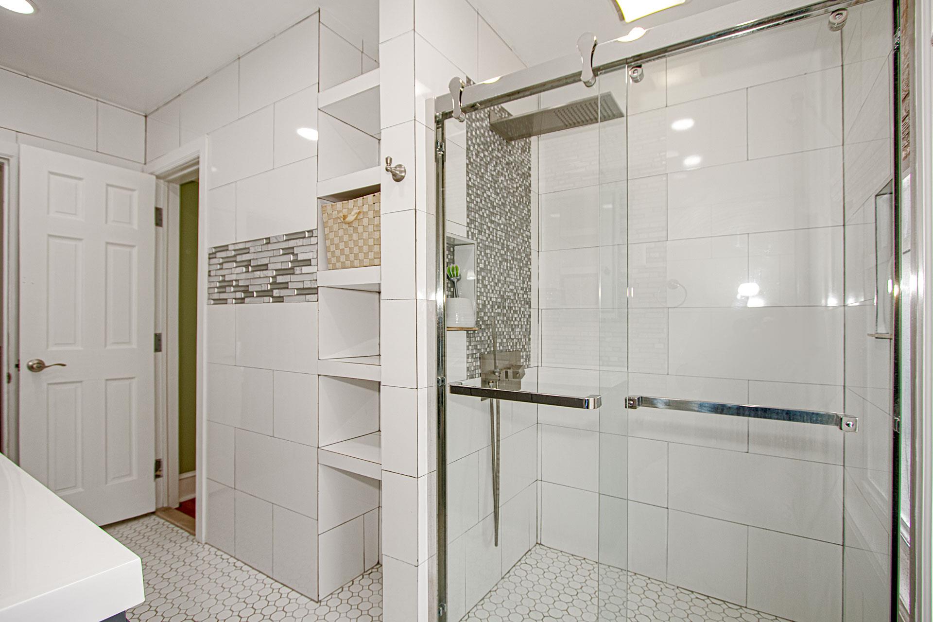 80-63 87th Road Queens, NY 11421 - Photo 9 of 24 a bathroom with a shower and a glass door