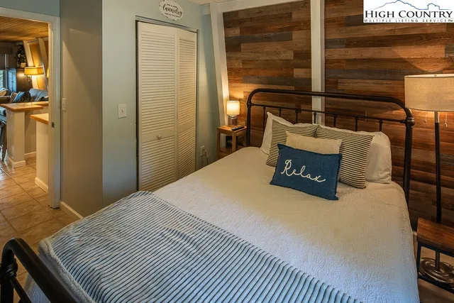 a bedroom with a bed and a cabinets