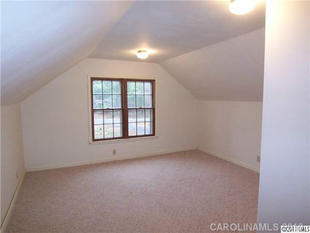 2717 Toddville Road Charlotte, NC 28214 - Photo 9 of 11 an empty room with windows