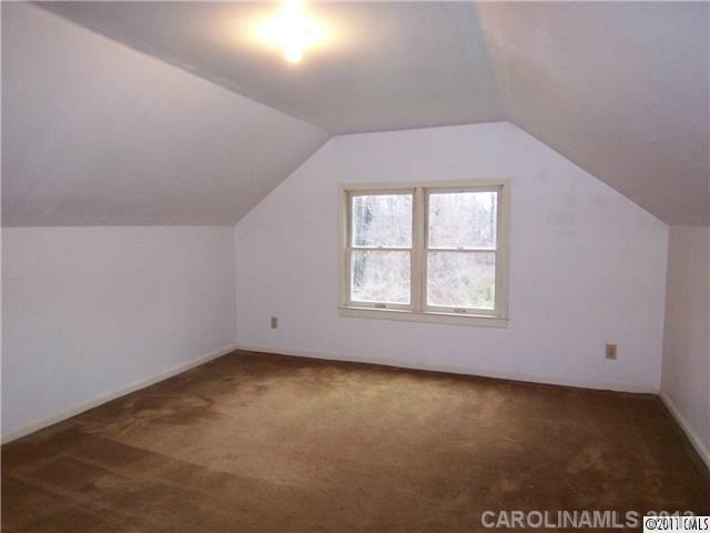 2717 Toddville Road Charlotte, NC 28214 - Photo 10 of 11 an empty room with a window