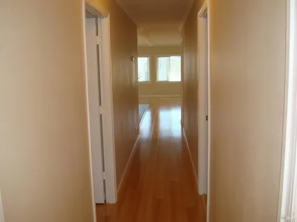 a view of a livingroom from a hallway