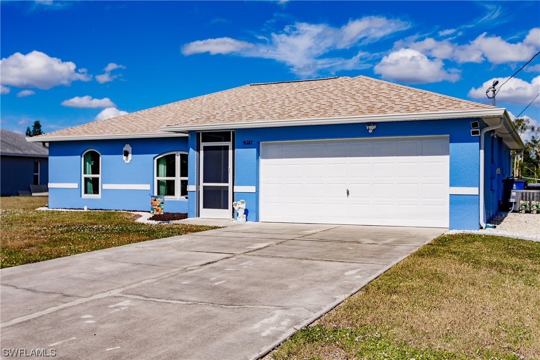 217 Manatee Street Fort Myers, FL 33913 - Photo 1 of 38 a view of a house with a yard