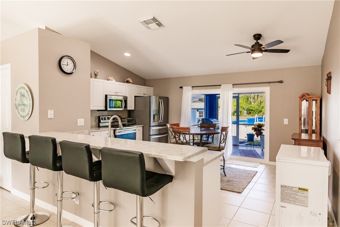 217 Manatee Street Fort Myers, FL 33913 - Photo 12 of 38 a living room with furniture and a window
