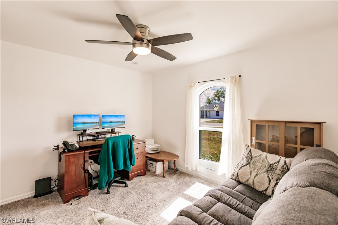 217 Manatee Street Fort Myers, FL 33913 - Photo 23 of 38 a living room with furniture and a window