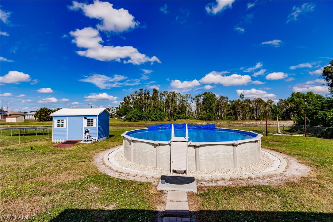 217 Manatee Street Fort Myers, FL 33913 - Photo 24 of 38 a view of a swimming pool with a yard